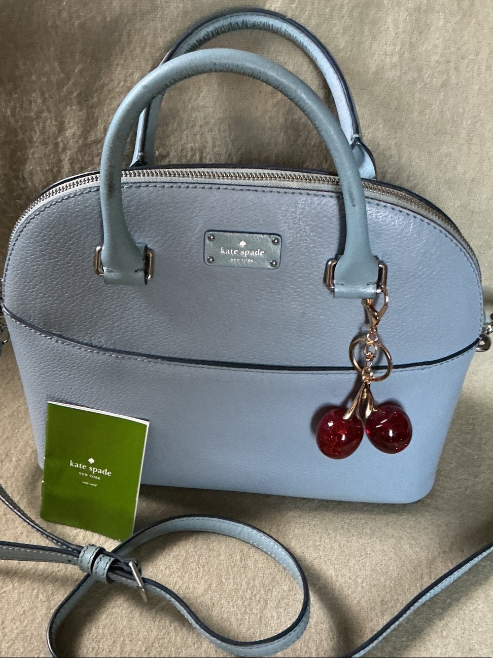 kate spade light blue leather dome satchel with red cherry charm